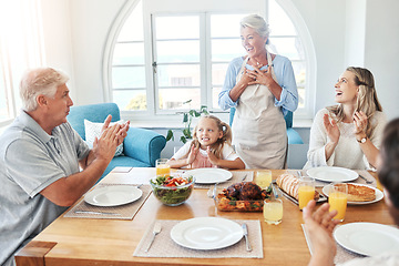 Image showing Big family, food celebration and child with parents and grandparents clapping hands for applause of holiday or birthday at home dining table. Happy senior man and woman, people and kid before eating