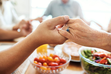 Image showing Praying, holding hands and food of family at dining room table with faith, gratitude and christian lifestyle. Prayer together, trust and spiritual people with healthy lunch, brunch or holiday meal