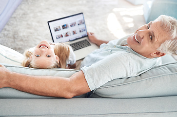 Image showing Portrait of relax grandfather, child and laptop with digital photo album, memory gallery and enjoy quality time together. Love, happy family bond or senior man with kid girl smile on living room sofa