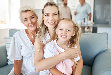 Image showing Family, love and generations with a girl, mother and grandmother sitting on a living room sofa in the home together. Kids, visit and children with a woman, parent and daughter in a house for a visit