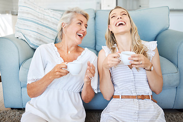 Image showing Coffee, mother and daughter with comic communication together on the living room floor of their house. Funny, happy and elderly mom with her child, tea and conversation in the lounge of their home