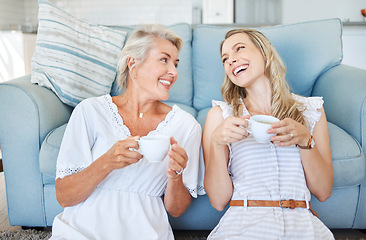 Image showing Coffee, comic communication and mother with daughter on the living room floor of their house. Elderly woman speaking, giving advice and in conversation with her adult child with tea in the lounge