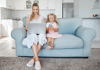 Image showing Family, phone and laptop with a girl and mother on the sofa in a home living room together while working or on social media. Computer, email and communication with a woman and daughter in a house