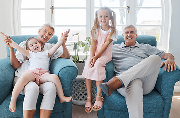 Image showing Happy grandparents, children and smile in relax for family bonding time together in the living room at home. Portrait of grandma, grandpa and little girls smiling in playful happiness for free time