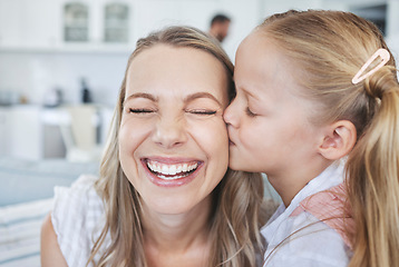 Image showing Girl, mother and kiss on cheek for love, happiness and bonding together in family home. Woman, smile and child kissing on face for mothers day, birthday and happy in house with kid, care and time