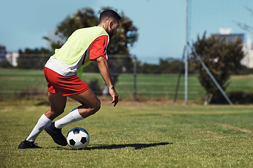 Image showing Man, running or soccer ball on grass field for sports, training or workout in competition match. Football player, athlete or fitness person in workout, training or exercise for wellness or speed game