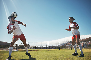 Image showing Sports, summer and soccer ball on head on field during game or training exercise. Health, fitness and ball header, teamwork at football competition and players on grass together for performance match
