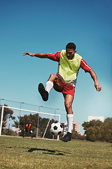 Image showing Sport, fitness and soccer training with soccer player in soccer ball power kick on a soccer field, energy, exercise and passion. Sports, football and football player ball practice on football field