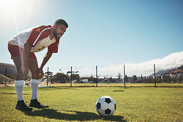 Image showing Soccer training, exercise and man at soccer field with ball, getting ready to kick, workout and play competitive sports game. Football, fitness and skill by professional athlete contemplating plan