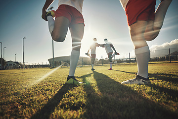Image showing Soccer, team and stretching together on sport field for exercise, wellness and workout practice for game day. Football, health and teamwork prepare for training, motivation and fitness before playing