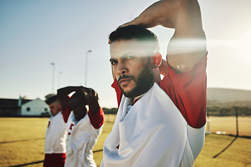 Image showing Sports, fitness and soccer player stretching with team for training, practice and workout exercise on football field. Teamwork, Brazil and healthy athlete in active warm up ready to start practice