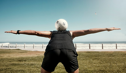 Image showing Soccer ball, balance back and sports training of a man athlete at the beach for a workout. Exercise, fitness and health cardio of a person on a field by sea water, ocean and nature in summer