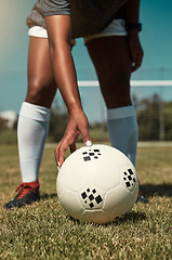 Image showing Hand, placing and soccer ball on field for free kick, penalty or goal in game, training or match. Woman, football and grass outdoor in summer for fitness, exercise and workout in sports for wellness