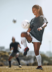 Image showing Football, sports and training with woman juggling with knees for workout, exercise and fitness on field. Health, wellness and practice with athlete and soccer ball for game, goals or cardio lifestyle