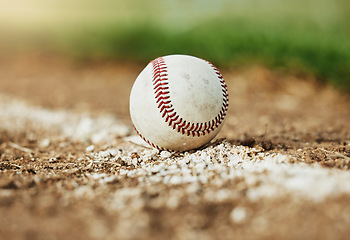 Image showing Baseball, sports and sport field on grass in nature on a outdoor training court. White ball on the ground for exercise, cardio training and fitness workout of player and athlete team game on a field