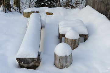 Image showing A Snow Covered Bench and Table