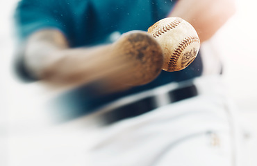 Image showing Baseball, sports and training where a bat hit a ball closeup for exercise, fitness or a workout. Homerun, score and health with a man athlete in a game or match swings and hits for points scoring