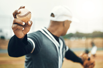 Image showing Baseball, athlete hand and ball sports while showing grip of pitcher outdoor in sport game. Exercise, game and softball with a professional player ready to throw or pitch during a match outside