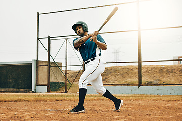 Image showing Baseball man, stadium game or hit ball with bat on a sport field in a game. Sports player with practice, strike and concentration to win match by competitive male batter focus during training outdoor
