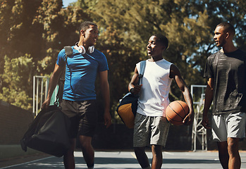 Image showing Basketball, team and sports friends walking relax after game, competition or training practice for athlete health, fitness or exercise. Basketball court workout, African or happy group of people talk