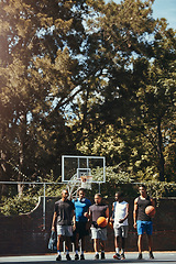 Image showing Sports, friends and basketball training at basketball court with group of men walking, talking and bonding before a match. Man, team and sport practice with basketball players discussing game plan