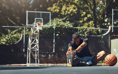 Image showing Sports fitness, basketball or man stretching before game, training competition or cardio exercise on basketball court. Health commitment, wellness or athlete warm up for start of sport game workout