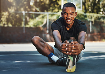 Image showing Black man, fitness and stretching leg in city, street or urban outdoors. Sports, health and happy male from Nigeria on ground, warm up or getting ready for running, training or workout exercise alone