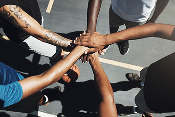 Image showing Hands, team and basketball in support, trust and coordination above for unity on the outdoor court. Hand of people in sports teamwork piling together for motivation and collaboration to win game