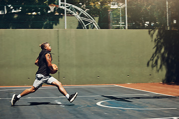 Image showing Young black man, basketball fitness outdoor training and running on court. Athletic sport wellness exercise, healthy lifestyle vision and professional player train for competition in sports park