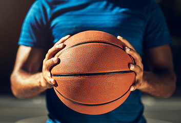 Image showing Hands, basketball and sports man ready for outdoor match game training with athletic grip closeup. Fitness, exercise and athlete male holding ball prepared to practice for competition macro.