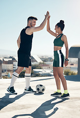 Image showing High five, happy and football friends for celebration, winner and partnership with success, goal and support in a city. Soccer, team and happy football people with ball, motivation or fitness outdoor