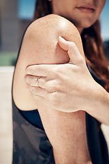 Image showing Runner, pain and woman with arm injury outdoors after fitness, running or cardio workout. Health emergency, accident and injured girl, athlete or female hand holding sore shoulder or painful muscle.