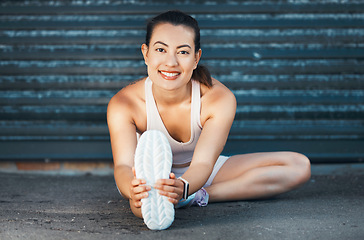 Image showing Fitness, woman and stretching with smile on street for warm up exercise, workout and health in the outdoors. Active female in leg stretch for healthy sports training or practice for cardio routine