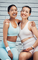 Image showing Women, hug and phone in city fitness, workout and training with heart cardio app, wellness motivation and exercise goals. Portrait, smile or happy sports friends bonding with mobile health technology