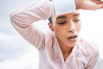 Image showing Fitness, tired and woman sweating in break after running exercise, training and workout in the outdoors. Exhausted female sports runner in relax, recovery and breath in healthy cardio exercising