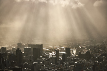 Image showing City, sky and architecture with downtown view of a building and skyscraper cityscape under clouds and sunlight. Business, office and buildings as a skyline view of an urban financial district