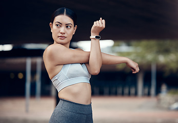 Image showing Fitness, woman and stretching in the city for workout, exercise and cardio in the outdoors. Active female in sports stretch for healthy training, warm up or exercising in an urban town