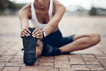 Image showing Woman, yoga and leg stretching in city outdoors for fitness exercise warm up, training or healthy lifestyle workout. Young female sports cardio routine, health and wellness program routine in town