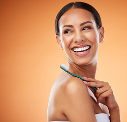 Image showing Toothbrush, dental care and woman with a smile in a studio with an orange background with mockup space. Healthy teeth, happy and girl model from Puerto Rico with mouth hygiene routine for oral health