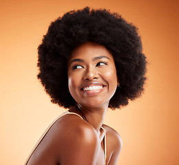 Image showing Black woman, african beauty and skincare health of luxury spa model with a smile on an orange studio background. Natural skin, healthy face and happy casual organic cosmetic afro hair treatment model