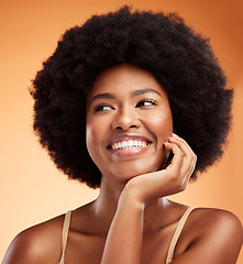 Image showing Beauty, black woman and happy wellness, aesthetic or natural makeup, glowing skincare and clean cosmetics on orange studio background. Smile young female model face, afro hair or thinking inspiration