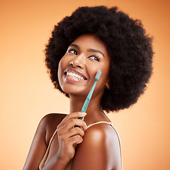 Image showing Brushing teeth, woman skincare and dental wellness, health or cleaning cosmetics on orange studio background. Happy young african model toothpaste, toothbrush and smile with afro hair, face and mouth