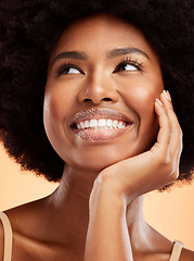 Image showing Face, beauty and skincare with a black woman thinking in studio on an orange background for cosmetics and wellness. Health, skin and care with a model female posing for antiaging treatment or product