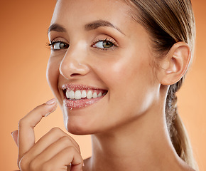 Image showing Woman beauty, sugar scrub lips and facial skincare cosmetics for mouth, makeup and face aesthetic on studio background. Portrait of happy model exfoliate, cleaning and natural peeling lipstick mask