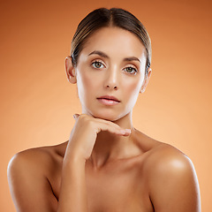 Image showing Face, beauty skincare and portrait of woman isolated on an orange studio background. Makeup, model and female from Canada with glowing skin, healthy skin or flawless skin after facial spa treatment.