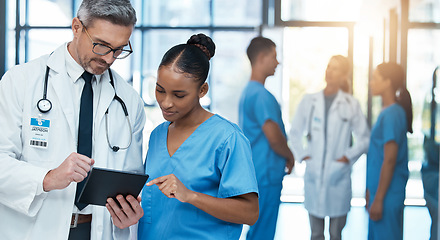 Image showing Doctor, healthcare and research with nurse on tablet in collaboration for diagnosis or prescription at the hospital. Medical GP and employee working together on touchscreen for patient clinic history