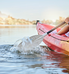 Image showing Calm lake, water sport and woman on kayak adventure for summer travel trip canoeing, kayaking and using paddle on river. Exercise, vacation or holiday with female enjoying rafting or boat activity