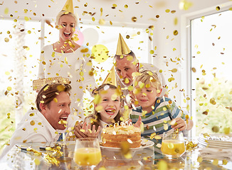 Image showing Kids happy birthday party, confetti surprise and family home with cake, celebration and happiness in Australia house together. Excited children, smile parents and grandparent celebrate special event