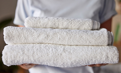 Image showing Woman, towels or laundry cleaning for hotel housekeeping maid, home cleaner service or relax resort worker. Zoom, texture or fabric cloth in hospitality hygiene maintenance or washing machine process