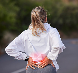 Image showing Woman, back pain and red injury in wellness exercise, training and health workout on Australian countryside road or street. Ache, inflammation and body tension for fitness marathon and sports runner